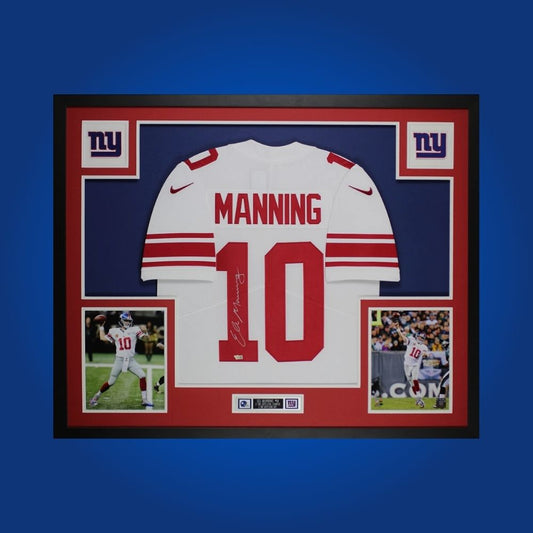 Framed New York Giants jersey signed by Eli Manning with Certificate of Authenticity