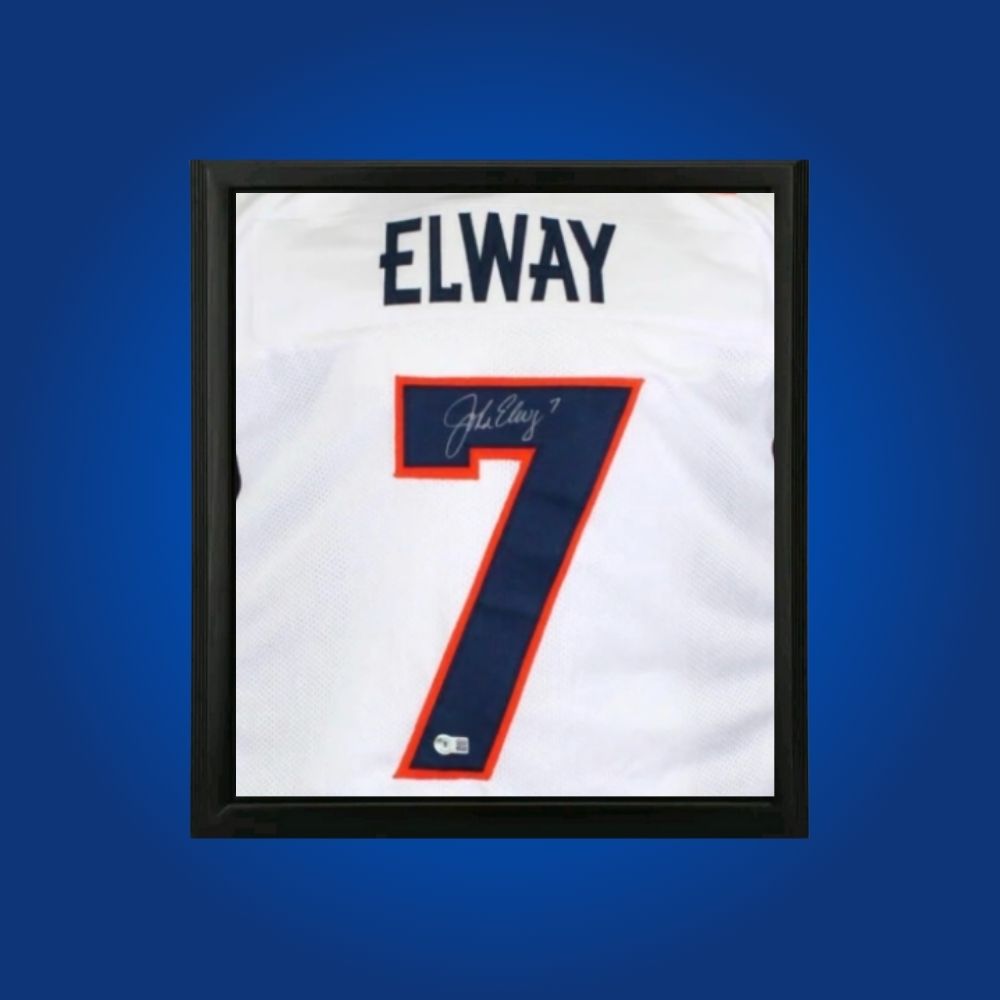 John Elway hand-signed white framed Denver Broncos jersey, showcasing signature and official team graphics. A unique collectible for Broncos fans and Elway memorabilia collectors. Includes Certificate of Authenticity. Images may differ for catalog uniformity.