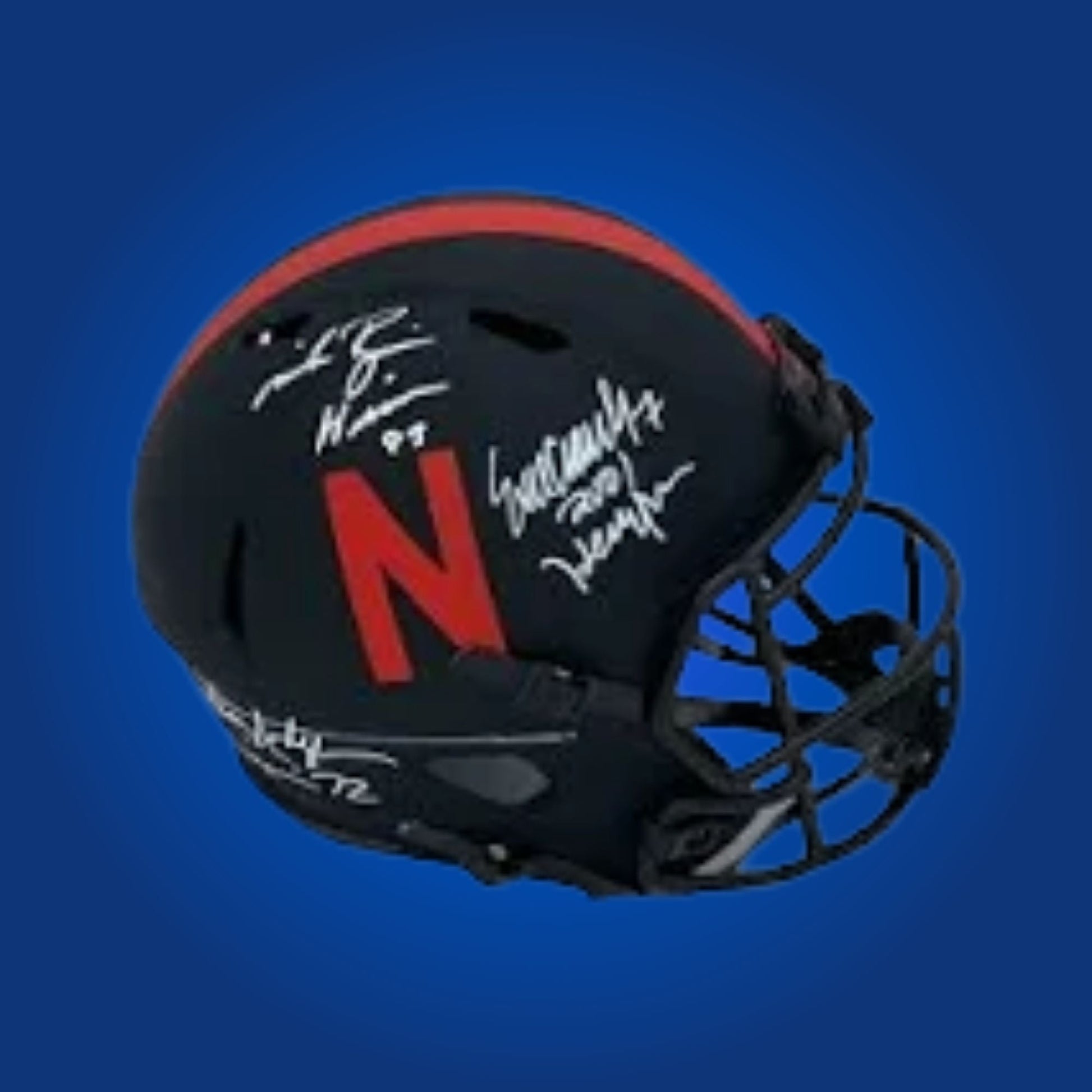 Autographed Nebraska Cornhuskers full size replica helmet signed by Eric Crouch, displayed on a white background. Sports memorabilia image.