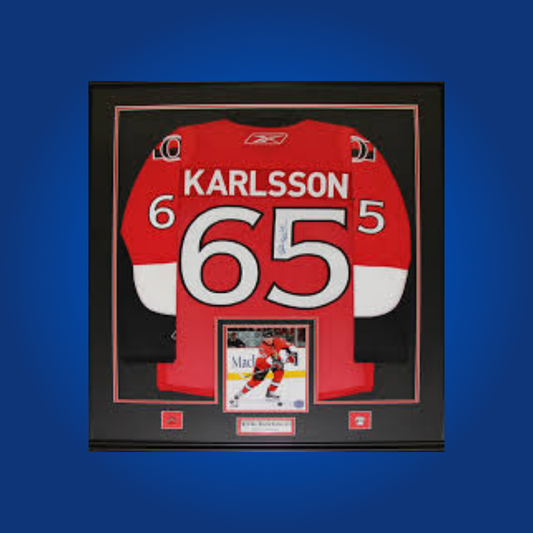 Erik Karlsson’s signed full framed Ottawa Senators red jersey is a standout collectible, celebrating the Norris Trophy-winning defenseman’s legacy and unforgettable moments in Ottawa.