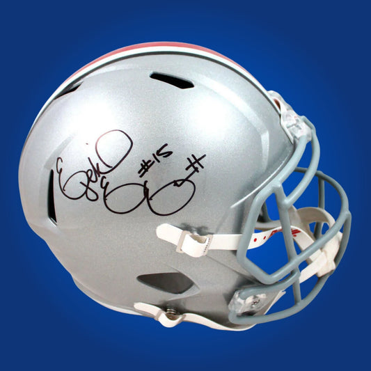 Autographed Ohio State Buckeyes full size replica helmet signed by Ezekiel Elliott, shown against a white background for product clarity. SportsMarkets exclusive memorabilia image.