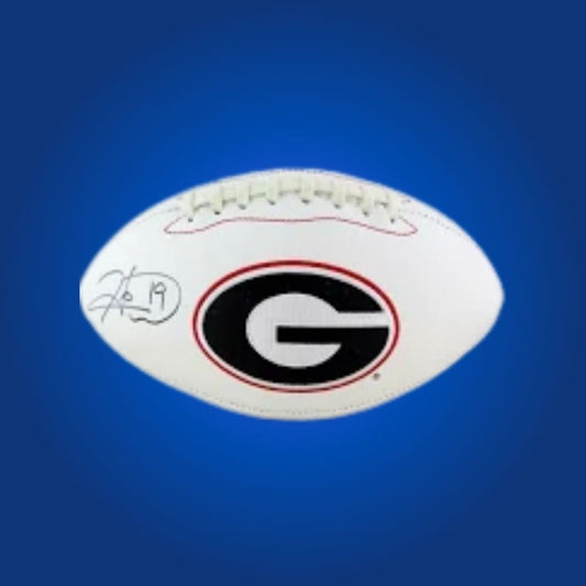 Hines Ward autographed Georgia Bulldogs white logo football, excellent collectible for Bulldogs fans and memorabilia collectors.
