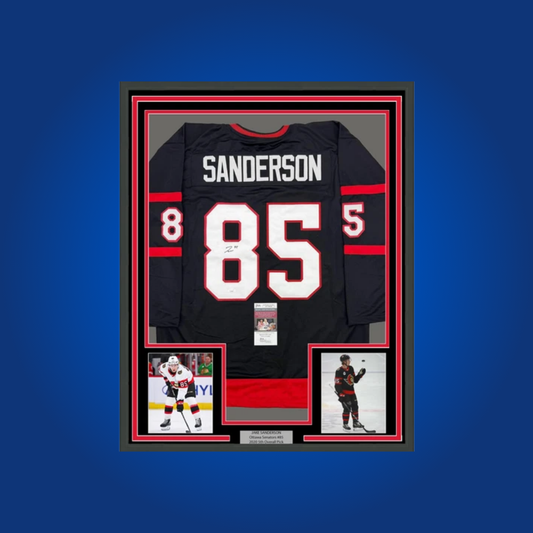 Jake Sanderson’s signed full framed Ottawa Senators black jersey is a standout piece for collectors, celebrating the emerging defenseman’s bright future in Ottawa.