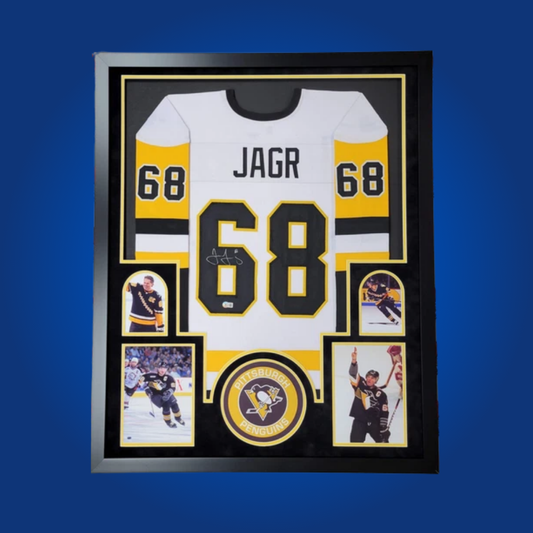 Jaromir Jagr’s signed full framed Pittsburgh Penguins white jersey is an essential collectible, celebrating the superstar’s electrifying career and unforgettable moments with the Penguins.