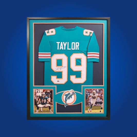 Autographed Miami Dolphins custom jersey by Jason Taylor with Certificate of Authenticity.