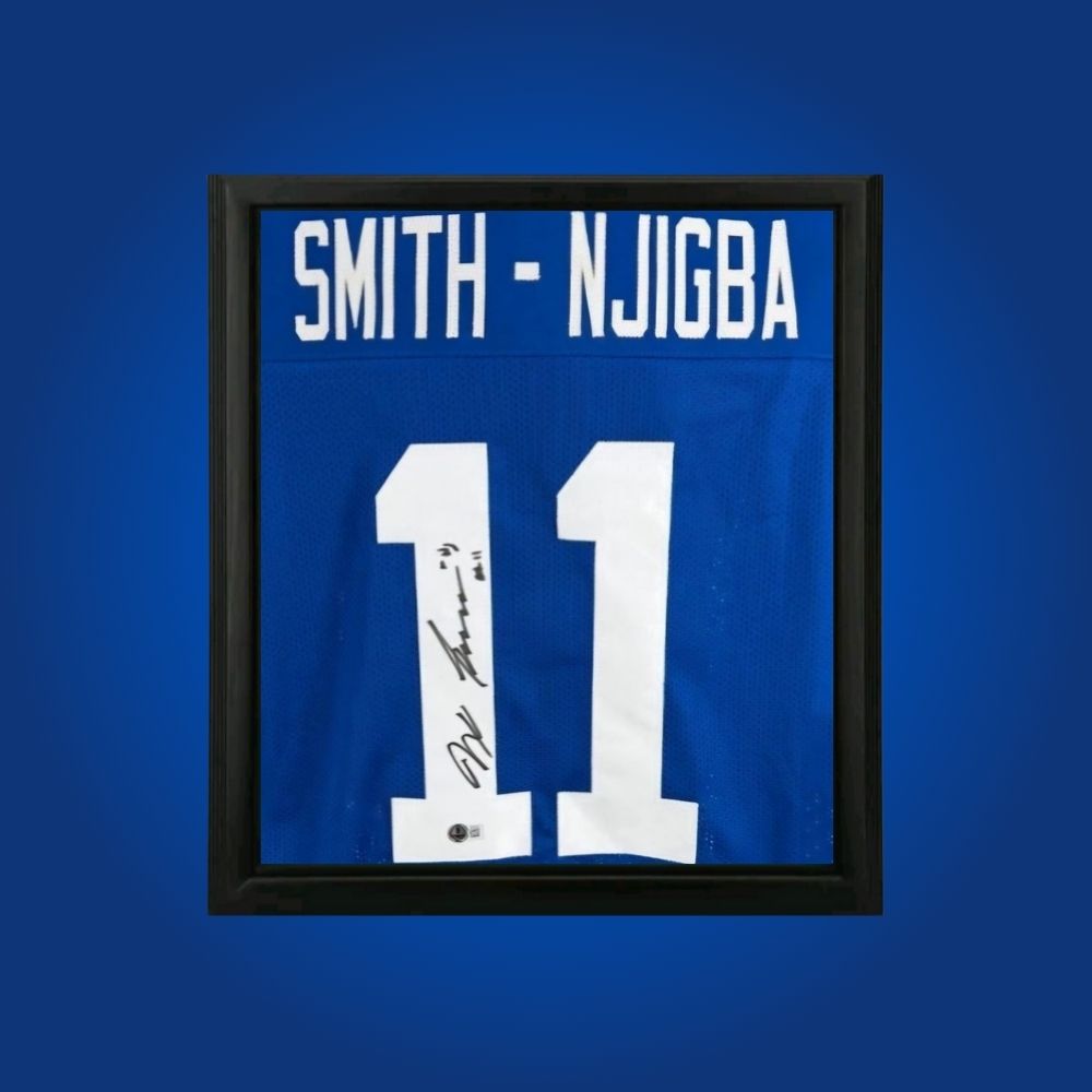Jaxon Smith-Njigba hand-signed framed Seattle Seahawks jersey, showcasing signature and official team graphics. A unique collectible for Seahawks fans and Smith-Njigba memorabilia collectors. Includes Certificate of Authenticity. Images may differ for catalog uniformity.