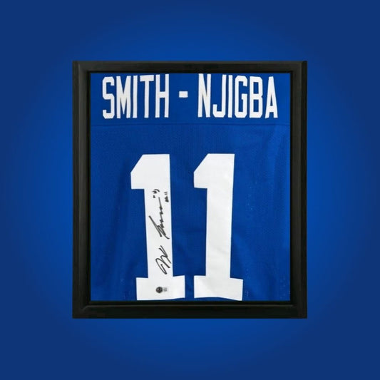 Jaxon Smith-Njigba hand-signed framed Seattle Seahawks jersey, showcasing signature and official team graphics. A unique collectible for Seahawks fans and Smith-Njigba memorabilia collectors. Includes Certificate of Authenticity. Images may differ for catalog uniformity.