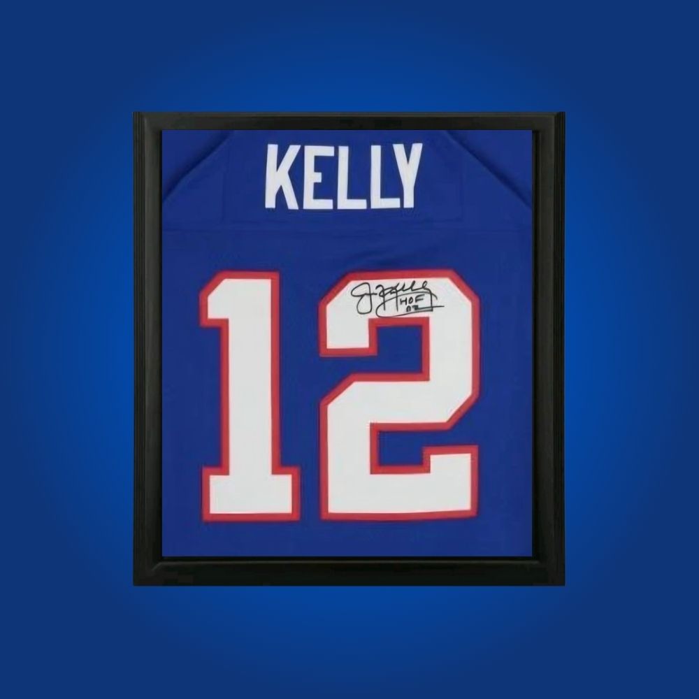 Jim Kelly hand-signed blue framed Buffalo Bills jersey, showcasing signature and official team graphics. A unique collectible for Bills fans and Kelly memorabilia collectors. Includes Certificate of Authenticity. Images may differ for catalog uniformity.