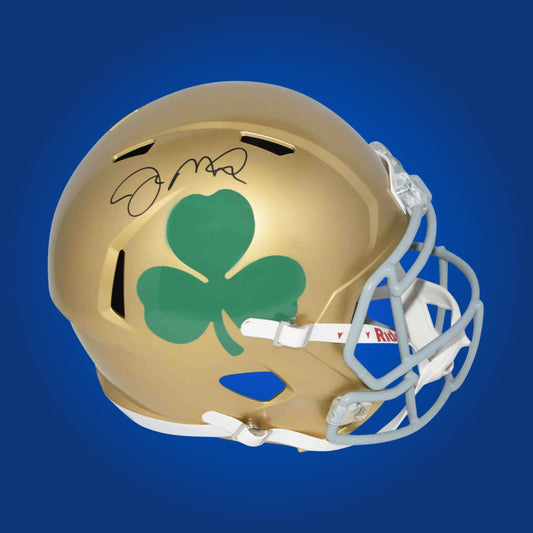 Autographed Notre Dame Fighting Irish full size replica helmet signed by Joe Montana, featured on a white background. SportsMarkets authentic memorabilia image.