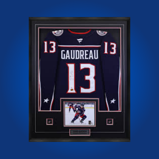 Johnny Gaudreau’s signed full framed Columbus Blue Jackets navy blue jersey is a premier collectible, celebrating the star winger’s arrival and dynamic play in Columbus.