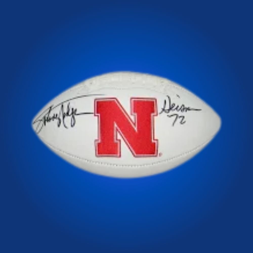 Johnny Rogers autographed Nebraska Cornhuskers white logo football, prized collectible for Nebraska fans and memorabilia collectors.