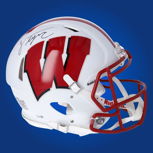 Autographed full size replica helmet by Jonathan Taylor, record-setting Wisconsin Badgers running back, displayed on a pristine white background for catalog clarity. A must-have for fans and memorabilia collectors. SportsMarkets product image.