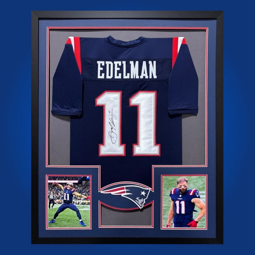 Julian Edelman hand-signed New England Patriots framed jersey, showcasing signature and official team graphics. A unique collectible for Patriots fans and Edelman memorabilia collectors. Includes Certificate of Authenticity. Images may differ for catalog uniformity.