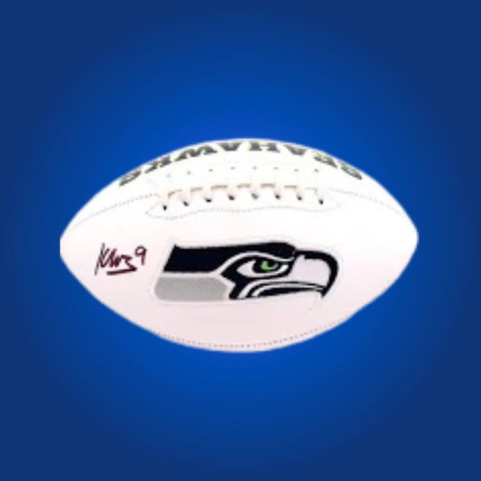Kenneth Walker signed Seahawks logo football, featuring rookie signature and Seattle team logo.