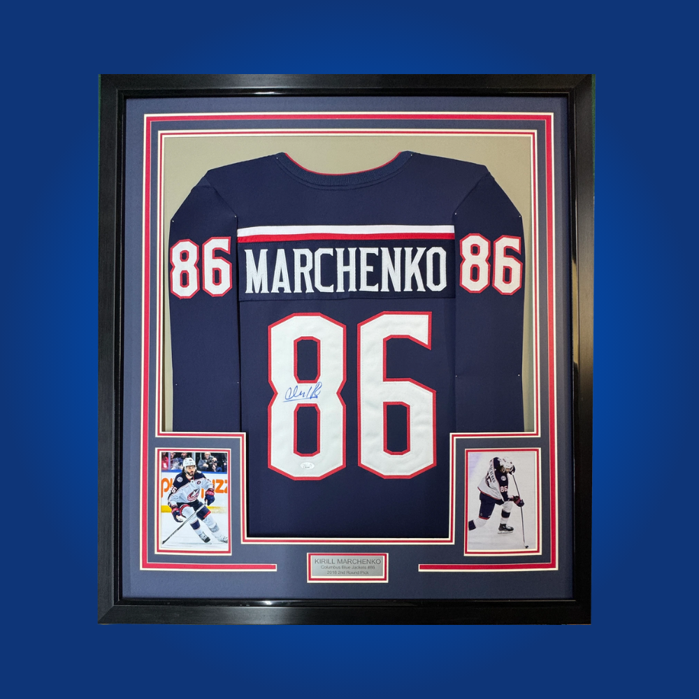 Kirill Marchenko’s autographed full framed Columbus Blue Jackets navy blue jersey is a must-have for fans and collectors of emerging NHL talent, showcasing his promise and skill.