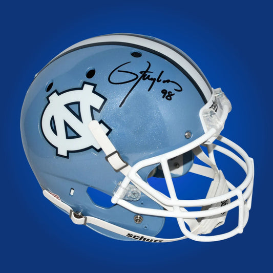 Autographed North Carolina Tar Heels full size replica helmet signed by Lawrence Taylor, showcased on a white background. SportsMarkets official memorabilia photo.