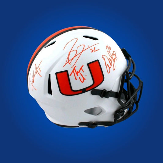 Lewis, Gore, and Sapp hand-signed Miami Hurricanes whiteout helmet, showcasing signatures and official team graphics. A unique collectible for Miami fans and Hurricanes memorabilia collectors. Includes Certificate of Authenticity. Images may differ for catalog uniformity.