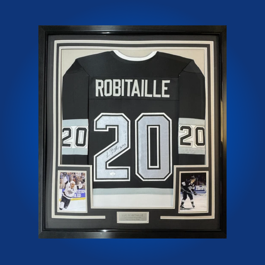 Luc Robitaille’s signature on this full framed Los Angeles Kings black jersey commemorates the Hall of Famer’s scoring prowess and lasting legacy with the franchise.
