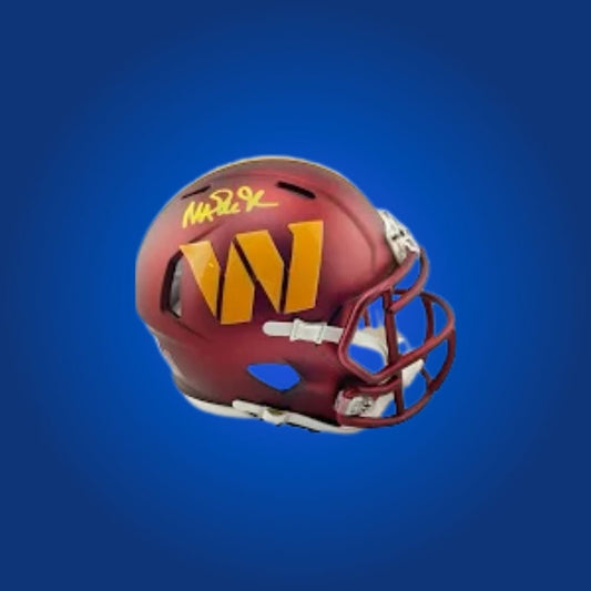 Washington Commanders mini helmet signed by Magic Johnson with Certificate of Authenticity.