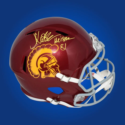 Autographed full size replica helmet by Marcus Allen, iconic USC Trojans running back and Heisman Trophy winner, displayed on a clean white backdrop for professional presentation. A prized collectible for fans and memorabilia enthusiasts. SportsMarkets product photo.