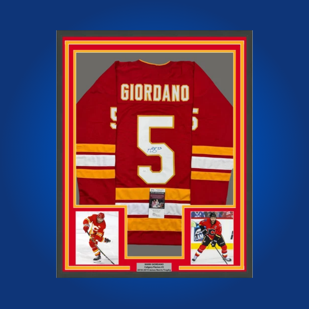Mark Giordano’s full framed Calgary Flames red jersey, autographed and authenticated, is a prized collectible for fans, celebrating the leadership and legacy of a Flames captain.