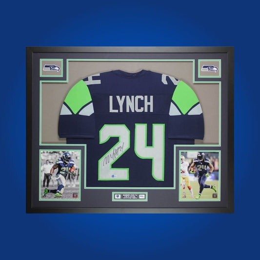Framed Seattle Seahawks jersey signed by Marshawn Lynch with action photos and Certificate of Authenticity.