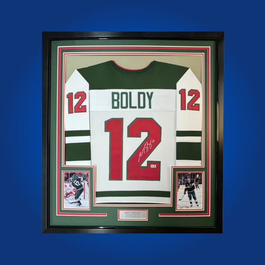 Matt Boldy’s full framed Minnesota Wild white jersey, personally autographed, is a standout collectible for fans of the team’s exciting young talent and a promising addition to any collection.