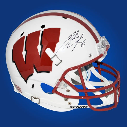 Autographed full size replica helmet by Melvin Gordon, standout Wisconsin Badgers running back, set against a clean white background for optimal product presentation. Great for memorabilia enthusiasts and Badgers supporters. SportsMarkets photo.