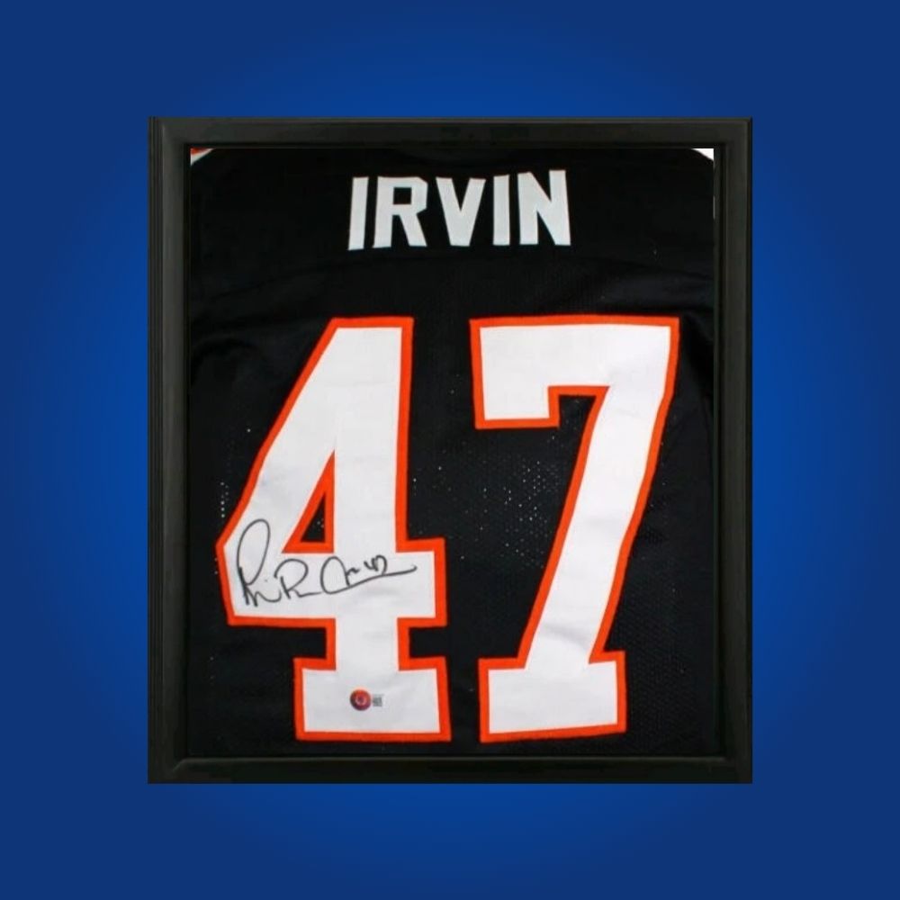 Michael Irvin hand-signed Miami Hurricanes black framed jersey, showcasing signature and official team graphics. A unique collectible for Miami fans and Irvin memorabilia collectors. Includes Certificate of Authenticity. Images may differ for catalog uniformity.