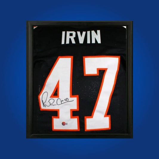 Michael Irvin hand-signed Miami Hurricanes black framed jersey, showcasing signature and official team graphics. A unique collectible for Miami fans and Irvin memorabilia collectors. Includes Certificate of Authenticity. Images may differ for catalog uniformity.