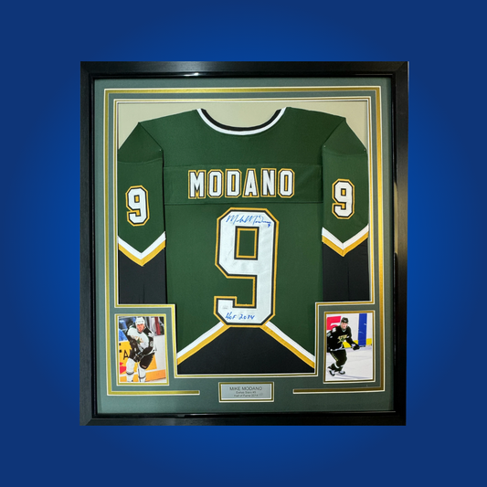 Mike Modano’s signature graces this full framed Dallas Stars green jersey—a tribute to one of the greatest American-born players and a must-have for Stars fans and memorabilia enthusiasts.