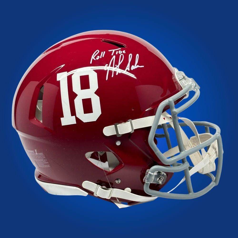 Autographed Alabama Crimson Tide full size Authentic Helmet signed by Nick Saban, presented on a clean white display. Exclusive SportsMarkets photo.