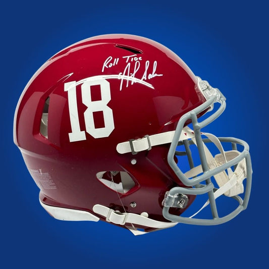 Autographed Alabama Crimson Tide full size Authentic Helmet signed by Nick Saban, presented on a clean white display. Exclusive SportsMarkets photo.