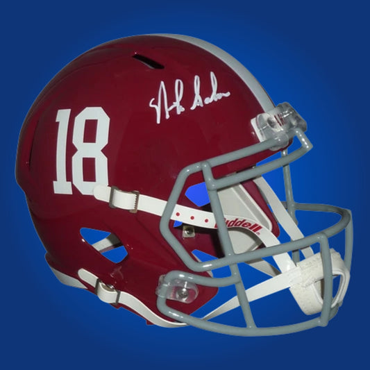 Autographed Alabama Crimson Tide full size replica helmet signed by Nick Saban, presented on a clean white display. Exclusive SportsMarkets photo.