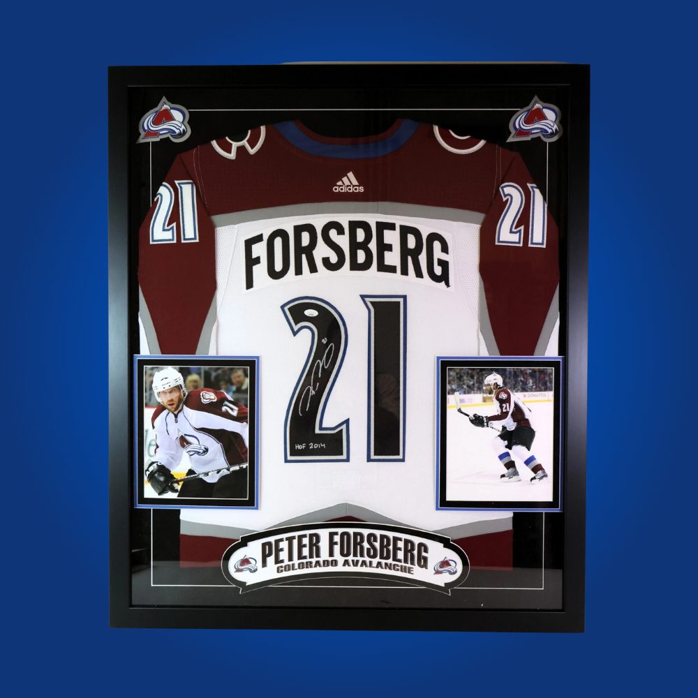 Peter Forsberg’s signature on this full framed Colorado Avalanche white jersey makes it a standout collectible, celebrating one of the franchise’s all-time greats and his lasting legacy.