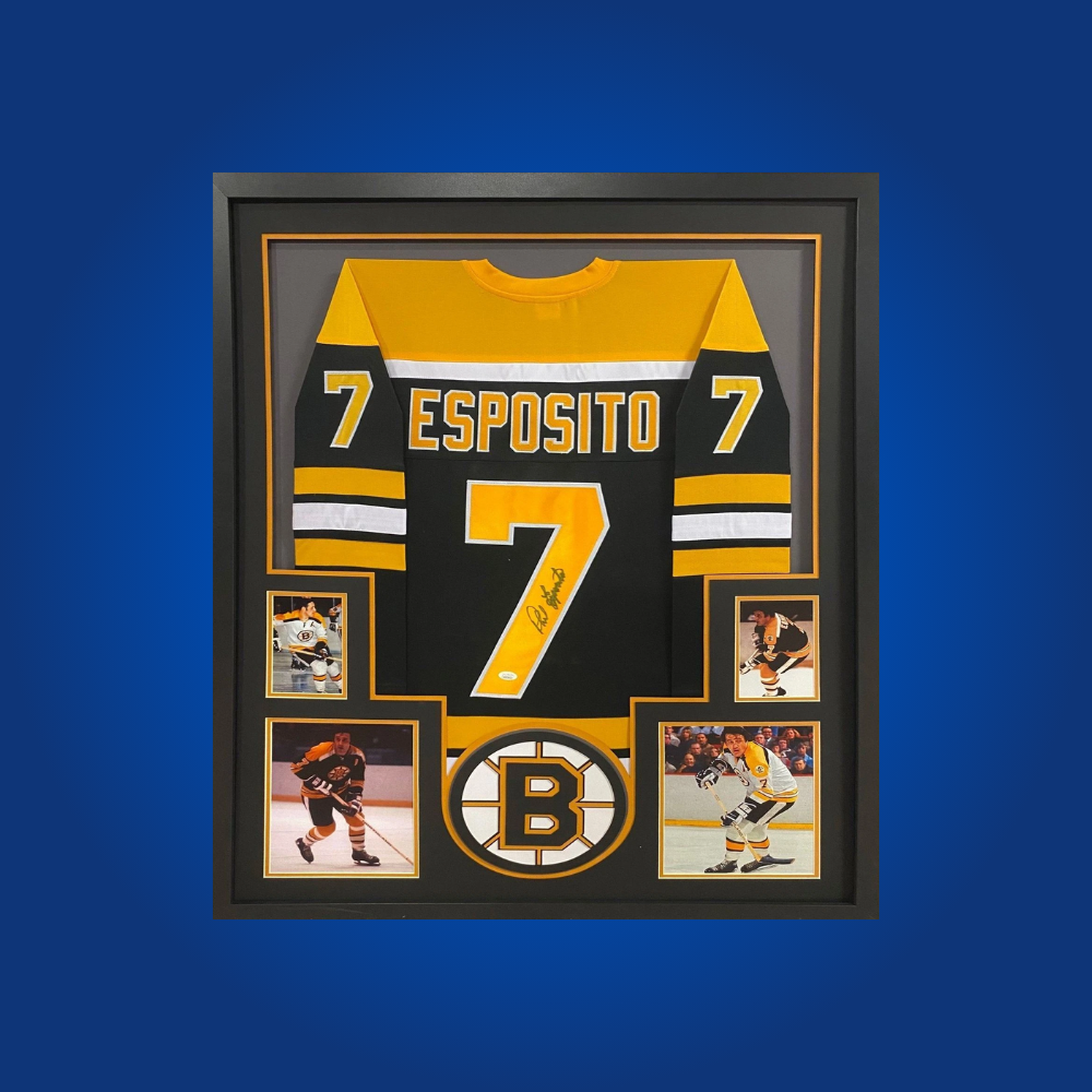 Celebrate Phil Esposito’s storied career with this full framed Boston Bruins white jersey, hand-signed by the Hall of Famer. An essential collectible for fans and hockey historians alike.