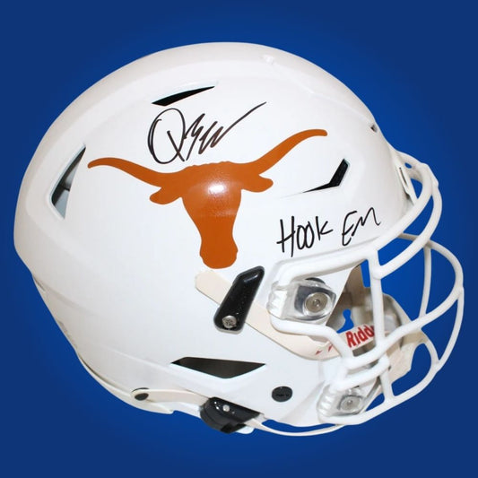 Autographed full size Authentic Helmet by Quinn Ewers, Texas Longhorns quarterback, presented against a neutral white setting. Perfect for collectors and fans. SportsMarkets memorabilia photo.