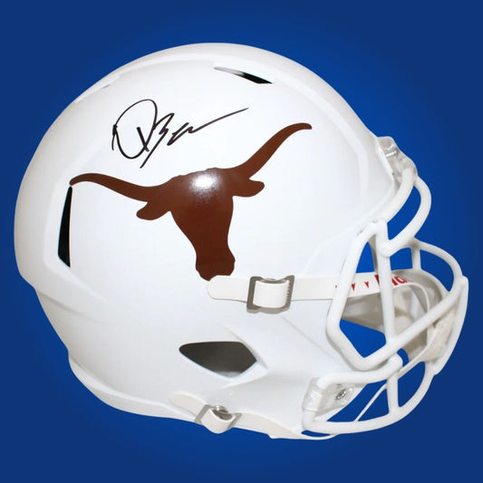 Autographed full size replica helmet by Quinn Ewers, Texas Longhorns quarterback, presented against a neutral white setting. Perfect for collectors and fans. SportsMarkets memorabilia photo.