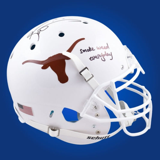 Autographed full size Authentic Helmet by Ricky Williams, Heisman Trophy winner and Texas Longhorns legend, set against a pristine white background. Ideal for memorabilia collections. SportsMarkets product photo.