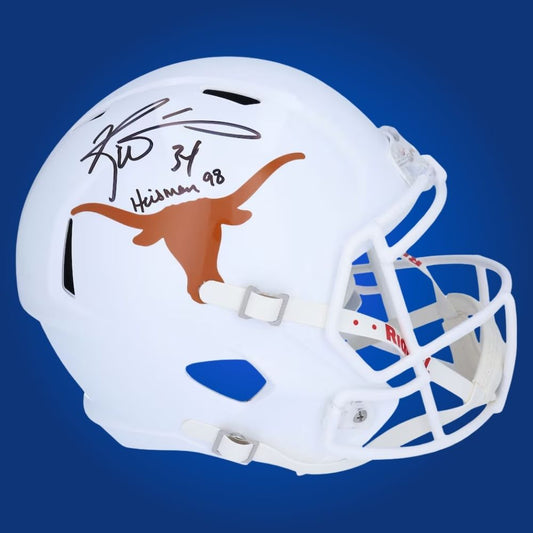 Autographed full size replica helmet by Ricky Williams, Heisman Trophy winner and Texas Longhorns legend, set against a pristine white background. Ideal for memorabilia collections. SportsMarkets product photo.