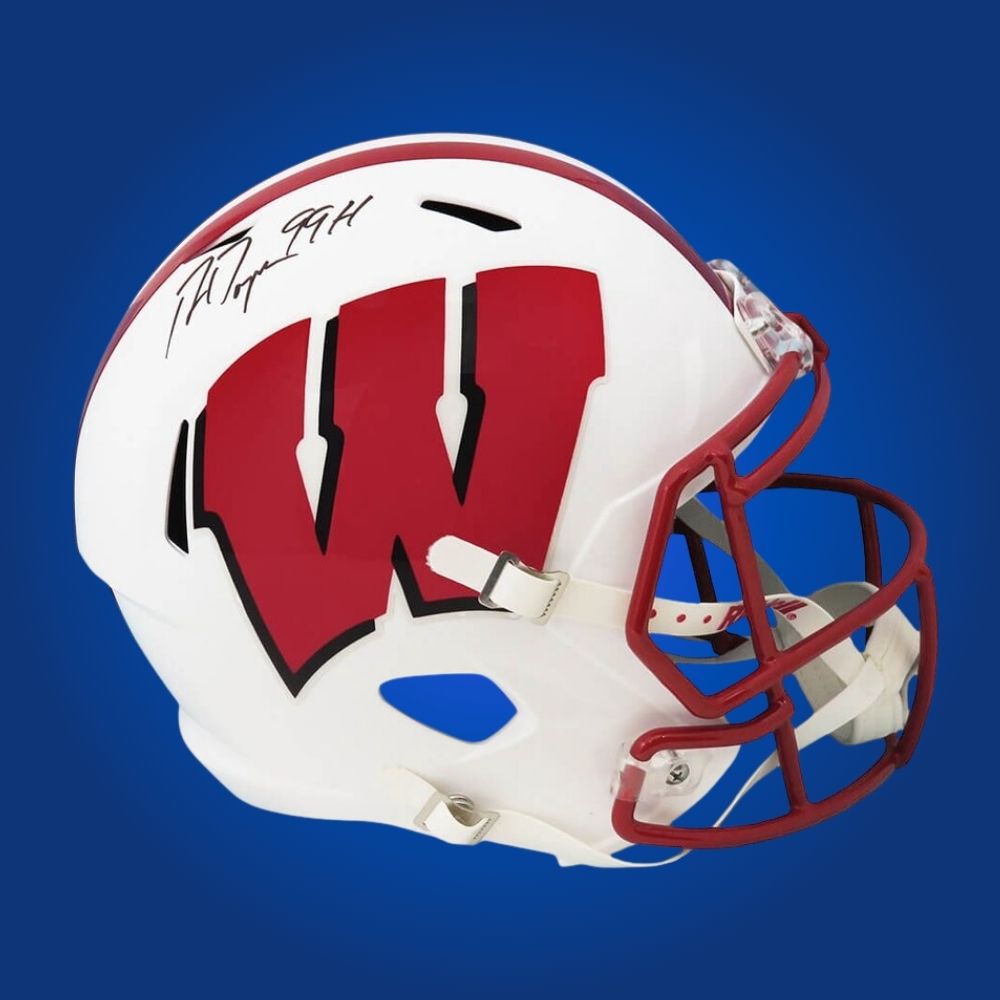 Autographed full size replica helmet by Ron Dayne, celebrated Wisconsin Badgers running back and Heisman winner, presented on a crisp white background. Excellent addition for collectors and Badgers supporters. SportsMarkets memorabilia photo.