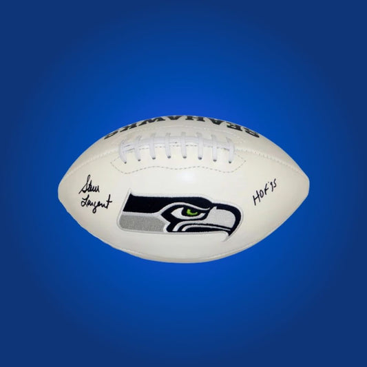Steve Largent autographed Seahawks logo football, featuring Hall of Fame receiver’s signature and Seahawks emblem.