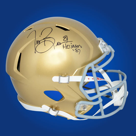 Autographed Notre Dame Fighting Irish full size replica helmet signed by Tim Brown, presented against a clean white background. SportsMarkets memorabilia photo.