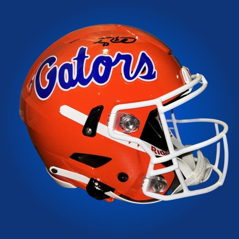 Autographed Florida Gators full size Authentic Helmet signed by Tim Tebow, shown on a clean white background. SportsMarkets product photo.