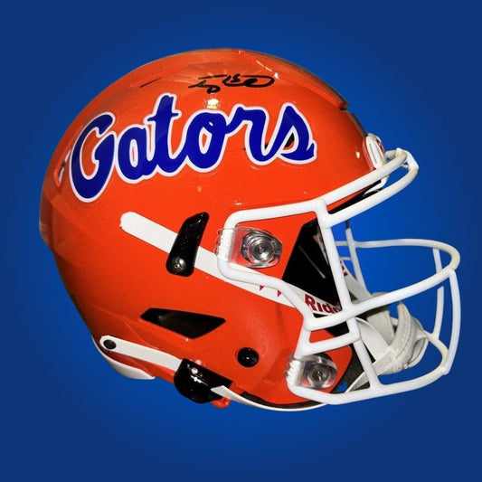Autographed Florida Gators full size Authentic Helmet signed by Tim Tebow, shown on a clean white background. SportsMarkets product photo.