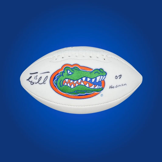Tim Tebow autographed Florida Gators white logo football, authentic collectible for passionate Gators fans.