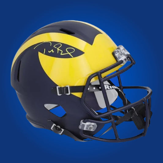 Autographed Michigan Wolverines full size replica helmet signed by Tom Brady, showcased on a white background. SportsMarkets exclusive memorabilia photo.