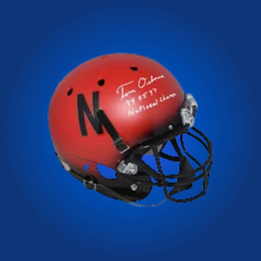 Autographed Nebraska Cornhuskers full size replica helmet signed by Tom Osborne, displayed on a plain background. Certified authentic sports memorabilia.
