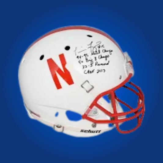 Autographed Nebraska Cornhuskers full size replica helmet signed by Tommy Frazier, displayed on a neutral background. SportsMarkets memorabilia image.