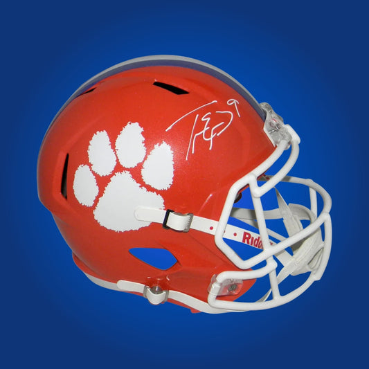 Autographed Clemson Tigers full size replica helmet signed by Travis Etienne, presented on a white background. SportsMarkets product image.